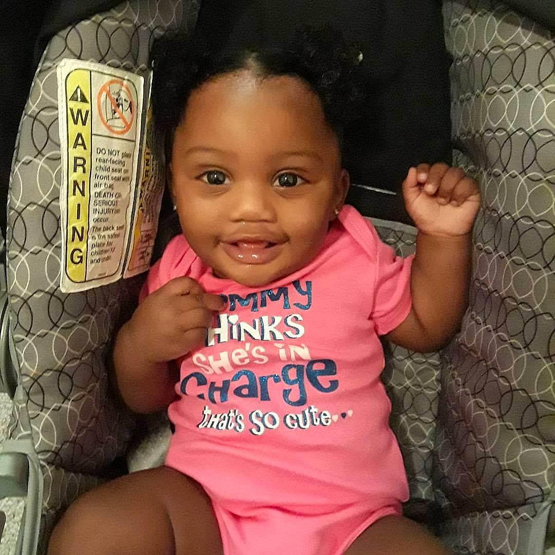 Jurnee Herron is registered to the contest to win money with this photo: arm, black_hair, cheek, child, cool, day, eye, finger, forehead, girl, hairstyle, head, infant, joy, mouth, nose, person, product, sitting, skin