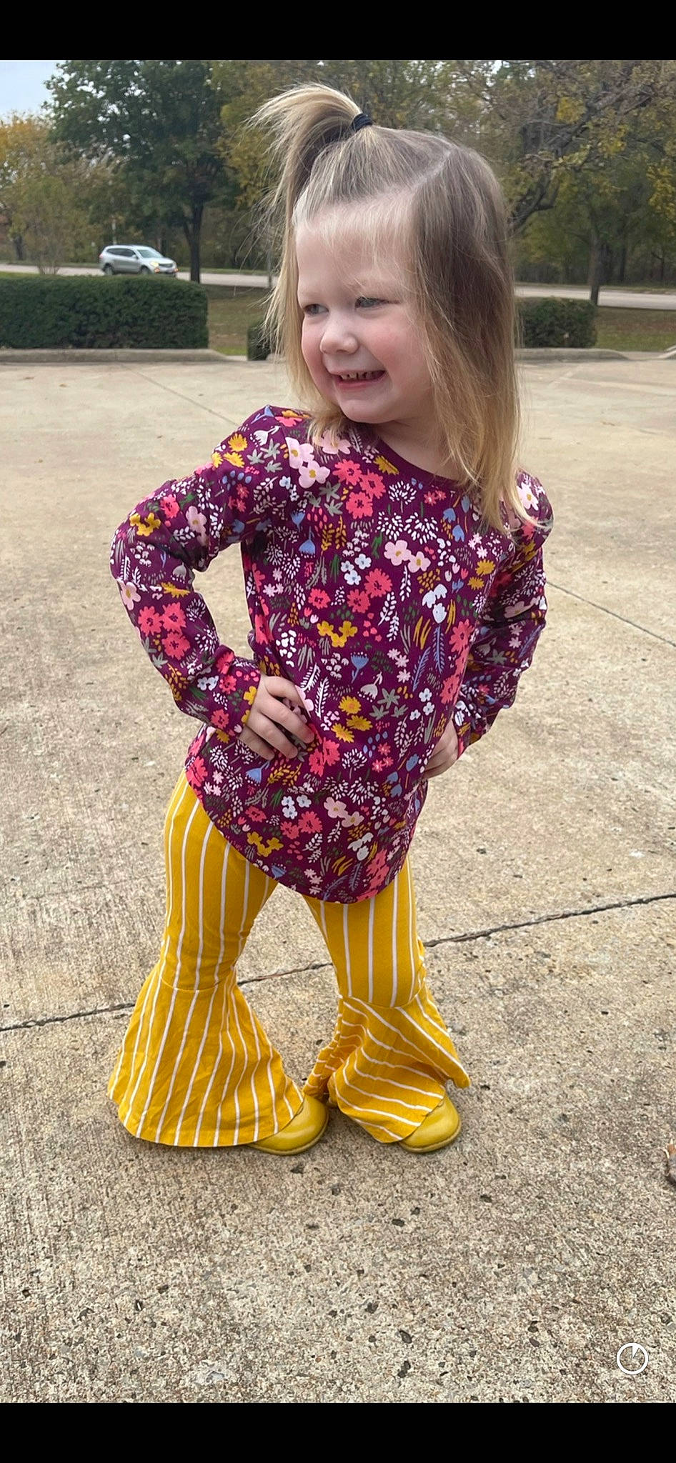 Raylin joined the competition — help win amazing prizes! baby_toddler_clothing, clothing, dress, face, fawn, grass, hair, hand, joy, leg, neck, orange, person, pink, plant, purple, sleeve, smile, street_fashion, thigh