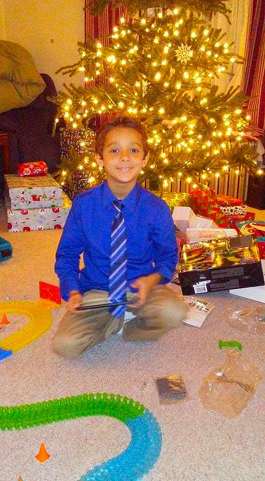 Malikai is registered to the contest to win money with this photo: child, christmas, christmas_eve, christmas_tree, event, holiday, interior_design, joy, person, play, toddler