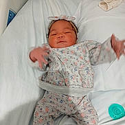 Pheonyx joined the competition — help win amazing prizes! baby, infant, bed, blanket, headband, floral_pattern, clothing, pacifier, hand, sleepwear, newborn, person, cute, indoors, soft, fabric, resting, child, hospital_bed, comfort