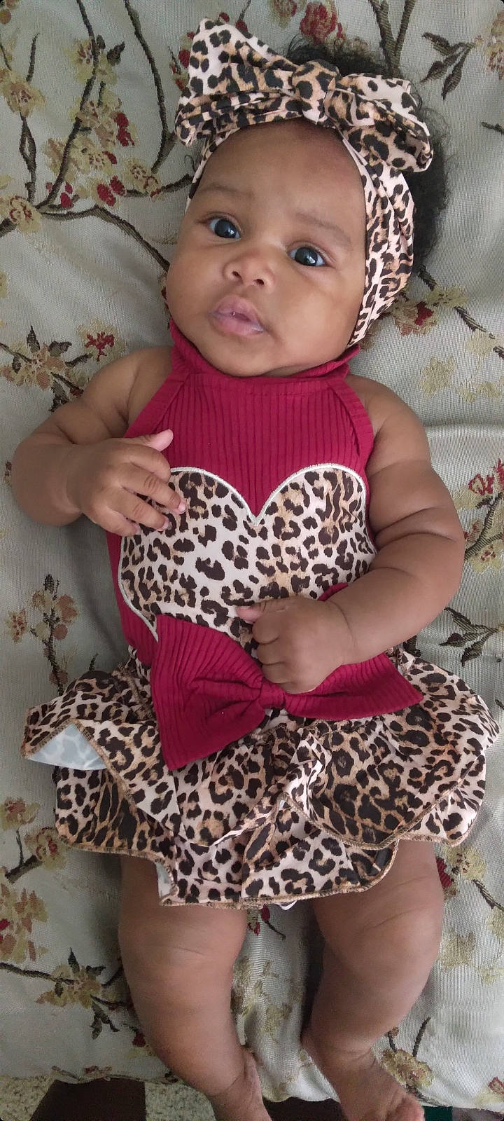 Jewel is registered to the contest to win money with this photo: baby, baby_toddler_clothing, day_dress, eyelash, fawn, hairstyle, head, lip, magenta, neck, organ, outerwear, pattern, person, pink, skin, sleeve, textile, thigh, toddler