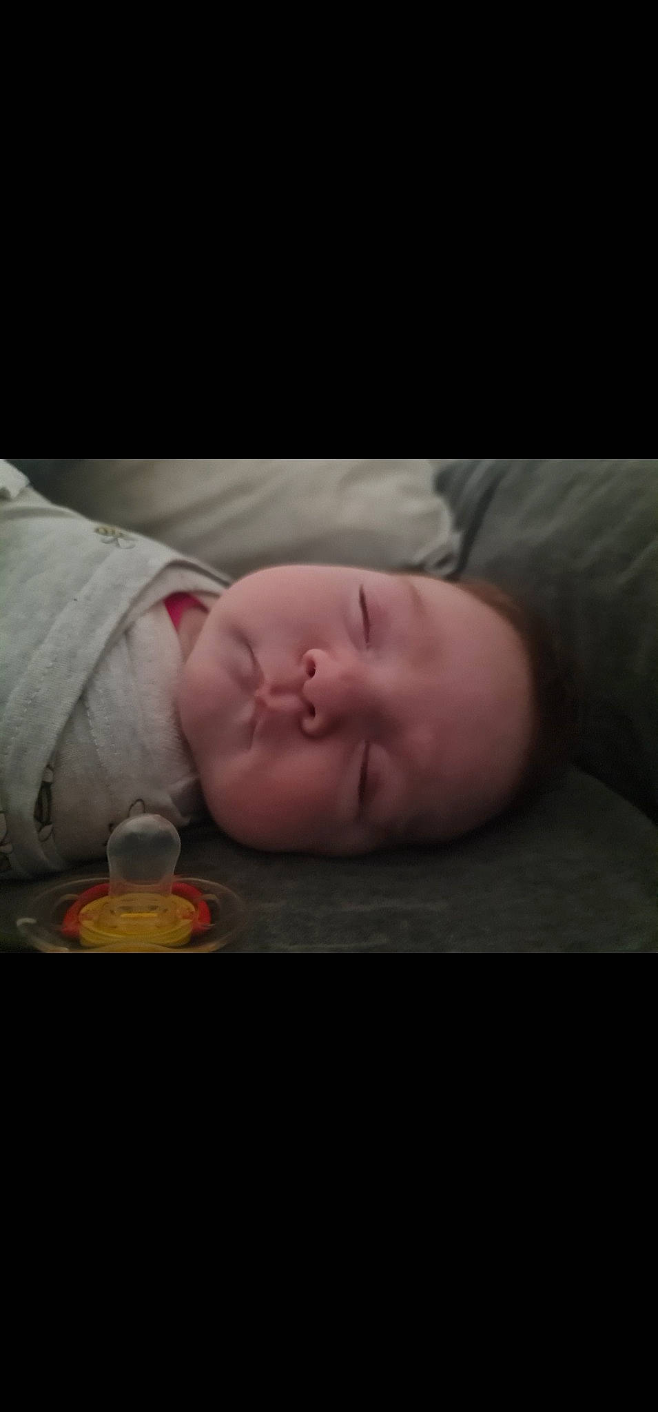 Harper is registered to the contest to win money with this photo: baby, baby_sleeping, baby_toddler_clothing, cheek, child, chin, comfort, darkness, eyelash, flash_photography, flesh, mouth, nose, person, portrait_photography, room, sitting, skin, smile, toddler