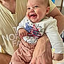Ellie participe au concours pour gagner de l'argent avec cette photo : baby, smiling, infant, adult, holding, white_shirt, pink_pants, indoor, happy, cute, person, skin, hand, clothing, face, parent, family, closeup, casual, light