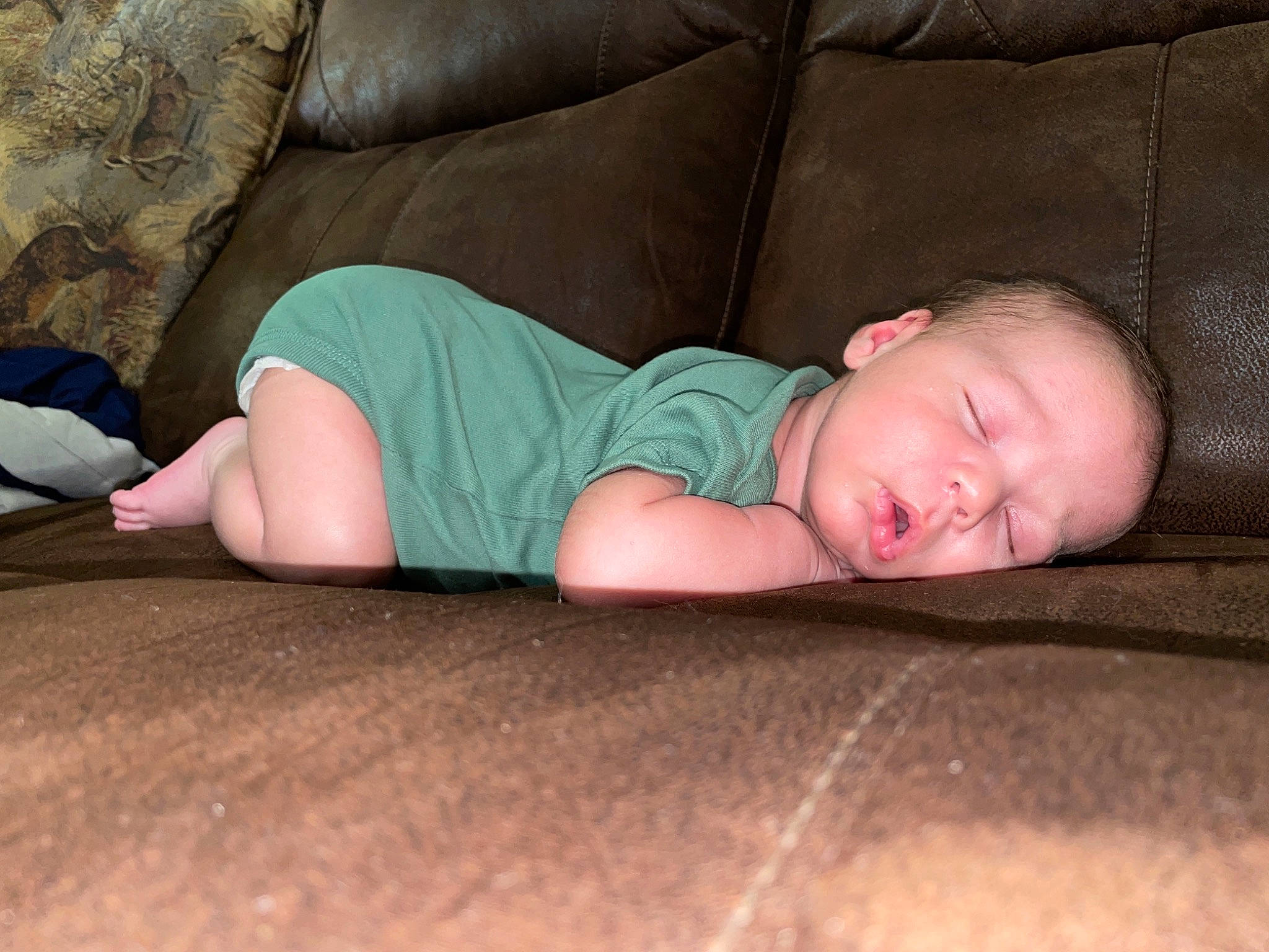 Raylen joined the competition — help win amazing prizes! baby, baby_toddler_clothing, child, comfort, couch, elbow, flash_photography, flooring, foot, grey, hardwood, human_leg, knee, linens, person, room, sitting, sleeve, thigh, toddler