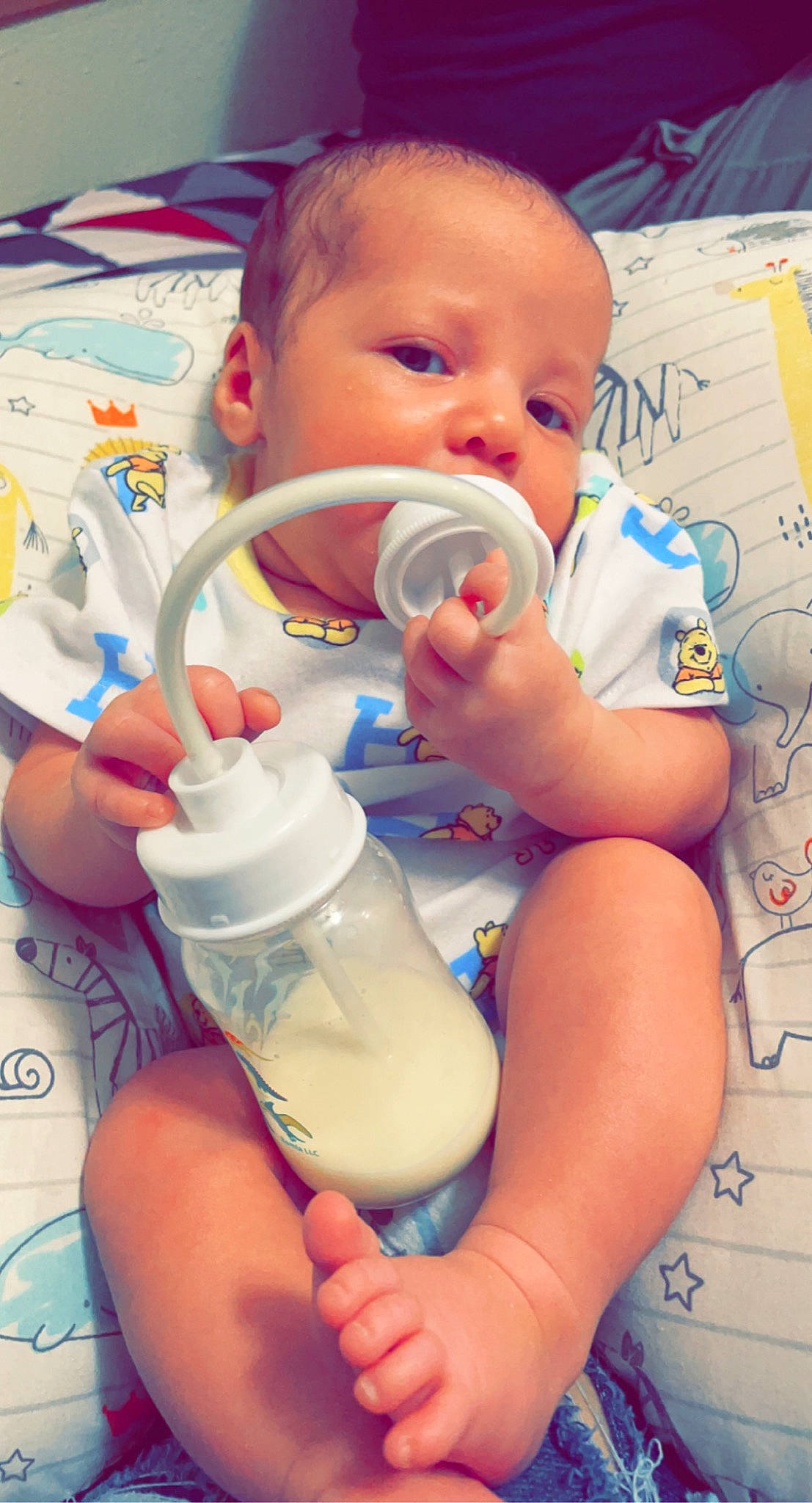 Raylen joined the competition — help win amazing prizes! baby, baby_bottle, baby_bottle_feeding, baby_toddler_clothing, bottle, cheek, drinkware, eyelash, facial_expression, finger, fluid, hairstyle, hand, liquid, mouth, organ, person, plastic_bottle, product, skin
