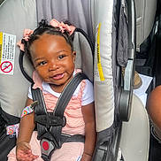 Heaven joined the competition — help win amazing prizes! baby, baby_accessory, car_interior, car_seat, child, clothing, cute, hair_bows, happy, indoor, infant, person, pink_clothing, portrait, safety, seat, seatbelt, skin, smiling, toddler