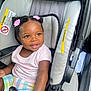 toddler, child, car_seat, smiling, hair_clips, pink, pastel_clothing, seat_belt, car_interior, happy, cute, baby, portrait, sitting, infant, safety, seat, young_child, person, indoors