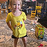 Auralia is registered to the contest to win money with this photo: child, toddler, yellow_shirt, bee_graphic, barefoot, carpet, indoor, toy, soccer_ball, bookshelf, chair, rocking_chair, desk, computer, floor, smile, blond_hair, person, home, play