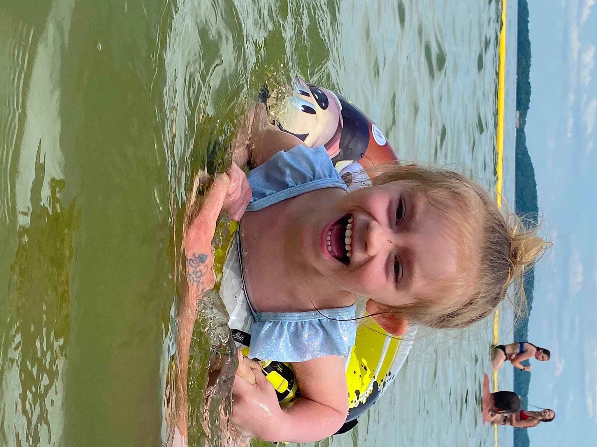 Sara is registered to the contest to win money with this photo: body_of_water, child, daytime, eyewear, fun, goggles, happy, joy, lake, leisure, people, people_in_nature, person, photograph, recreation, skin, smile, snapshot, summer, sunglasses