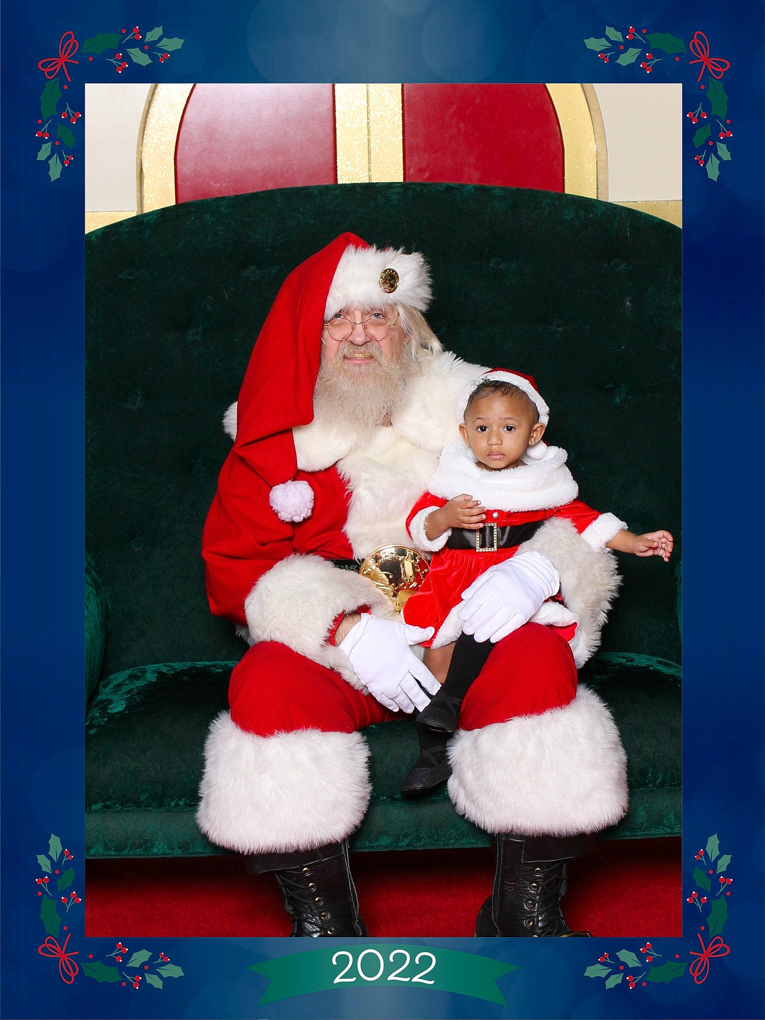 Alaiyah is registered to the contest to win money with this photo: baby, child, christmas, christmas_eve, event, fictional_character, happy, hat, headwear, holiday, human_body, interior_design, lap, person, rectangle, red, santa_claus, smile, toddler, winter