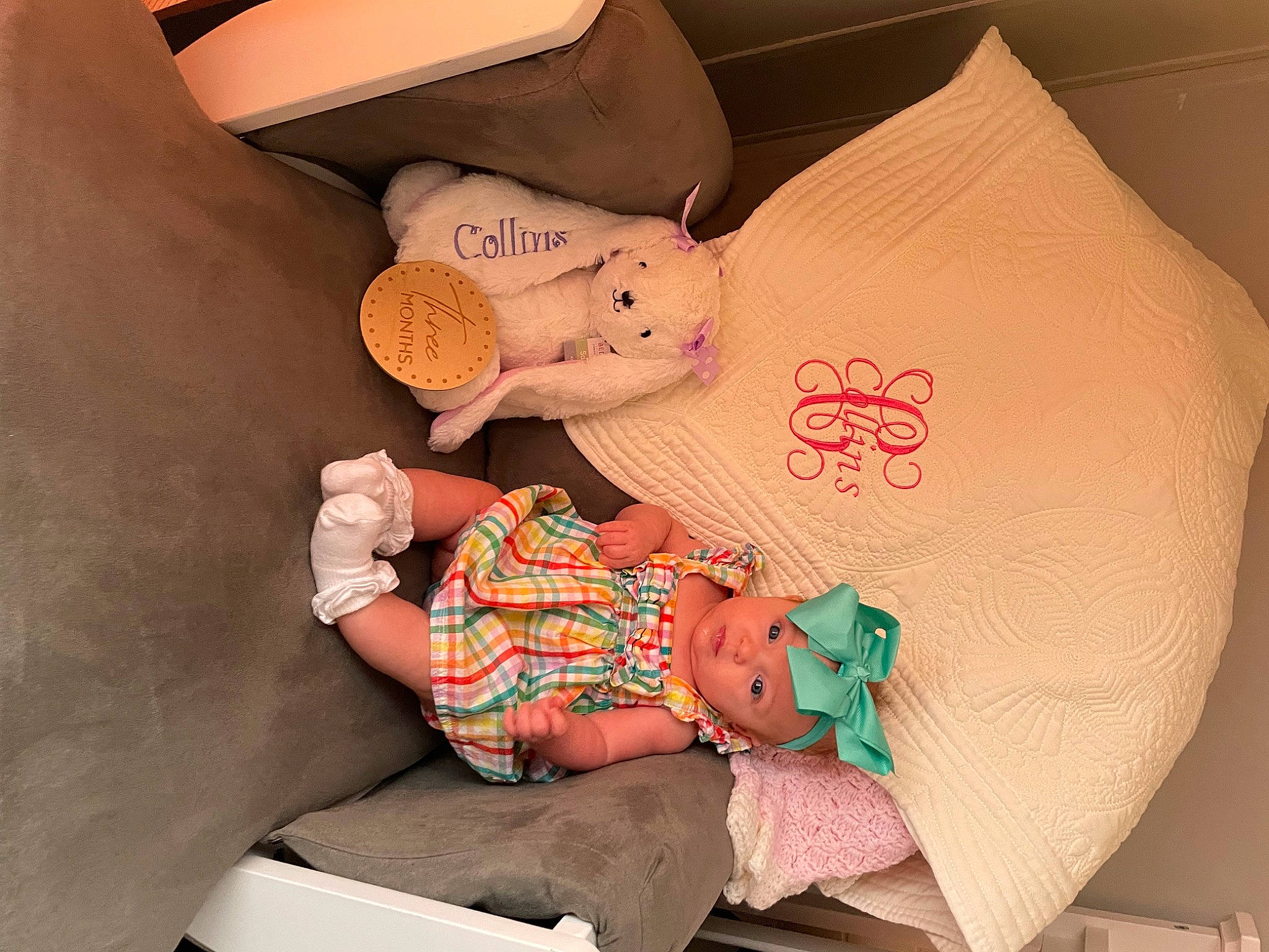 Collins is registered to the contest to win money with this photo: abdomen, baby, baby_products, baby_sleeping, baby_toddler_clothing, bedding, child, comfort, finger, hand, headwear, human_leg, leg, linens, orange, pattern, person, pink, sleeve, sock