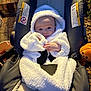 Nolan is registered to the contest to win money with this photo: baby, blanket, bodypart, bonnet, cap, car, car_interior, carseat, clothing, face, finger, hand, hat, head, hood, person, photography, portrait, transportation, vehicle