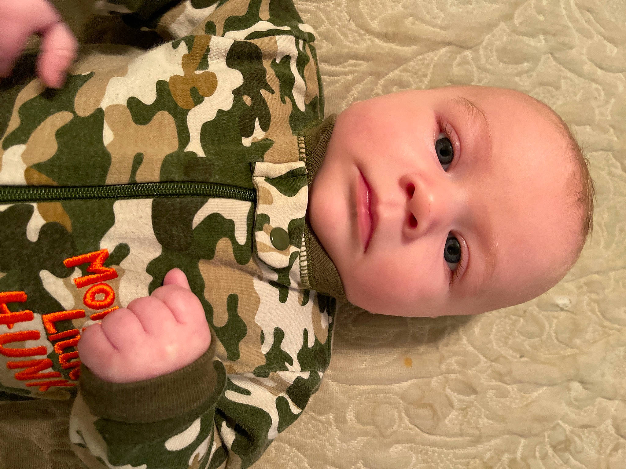 Balin is registered to the contest to win money with this photo: baby, baby_toddler_clothing, beauty, camouflage, cheek, comfort, eyelash, finger, flooring, gesture, happy, military_camouflage, military_uniform, nail, pattern, person, skin, sleeve, thumb, toddler