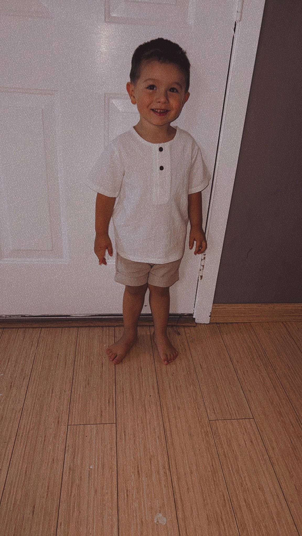 Legend is registered to the contest to win money with this photo: baby_toddler_clothing, barefoot, collar, dress_shirt, flooring, foot, happy, hardwood, joy, knee, laminate_flooring, neck, person, shoulder, skin, sleeve, smile, t_shirt, toddler, varnish
