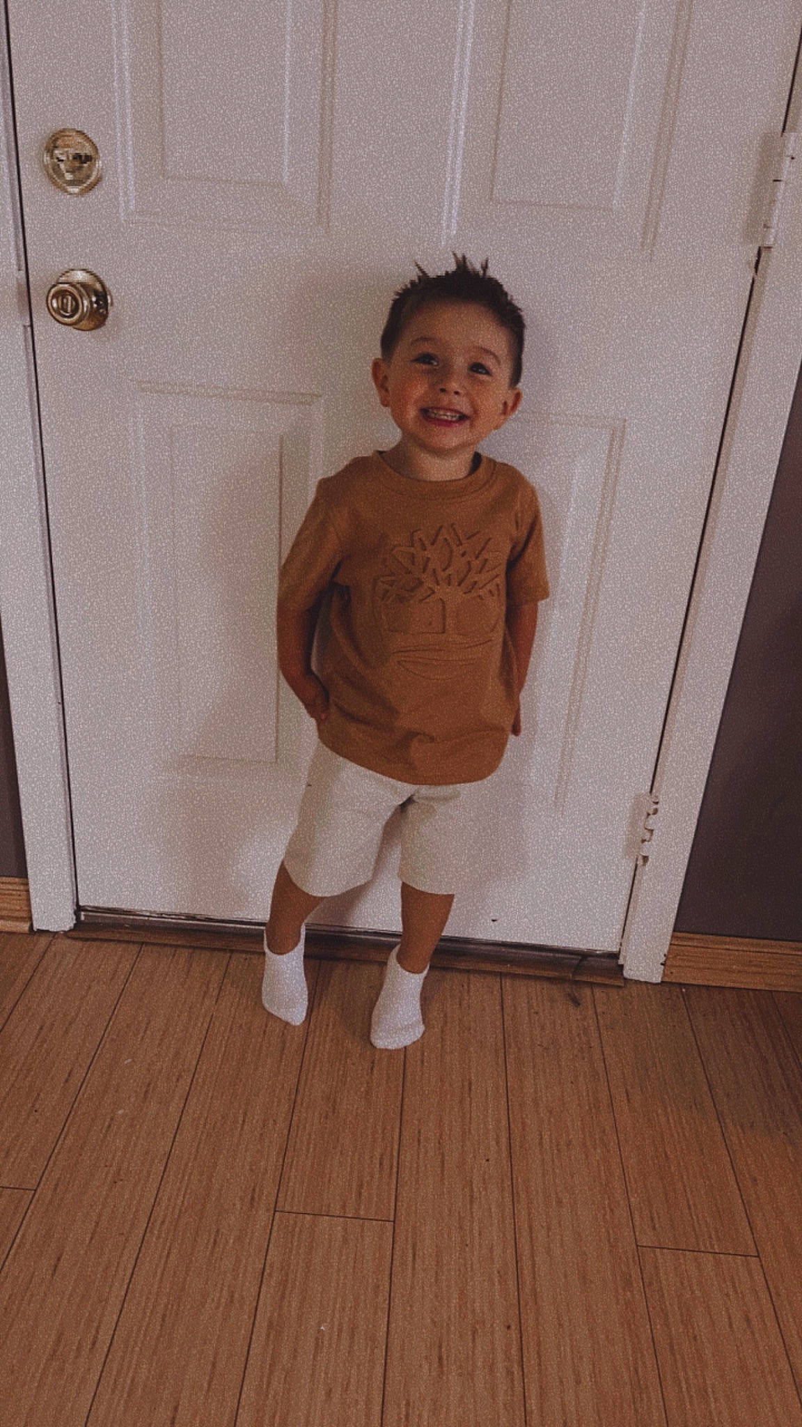 Legend joined the competition — help win amazing prizes! baby_toddler_clothing, floor, flooring, hardwood, joy, knee, laminate_flooring, leg, pattern, person, plank, shorts, sleeve, smile, t_shirt, thigh, toddler, trunk, varnish, waist