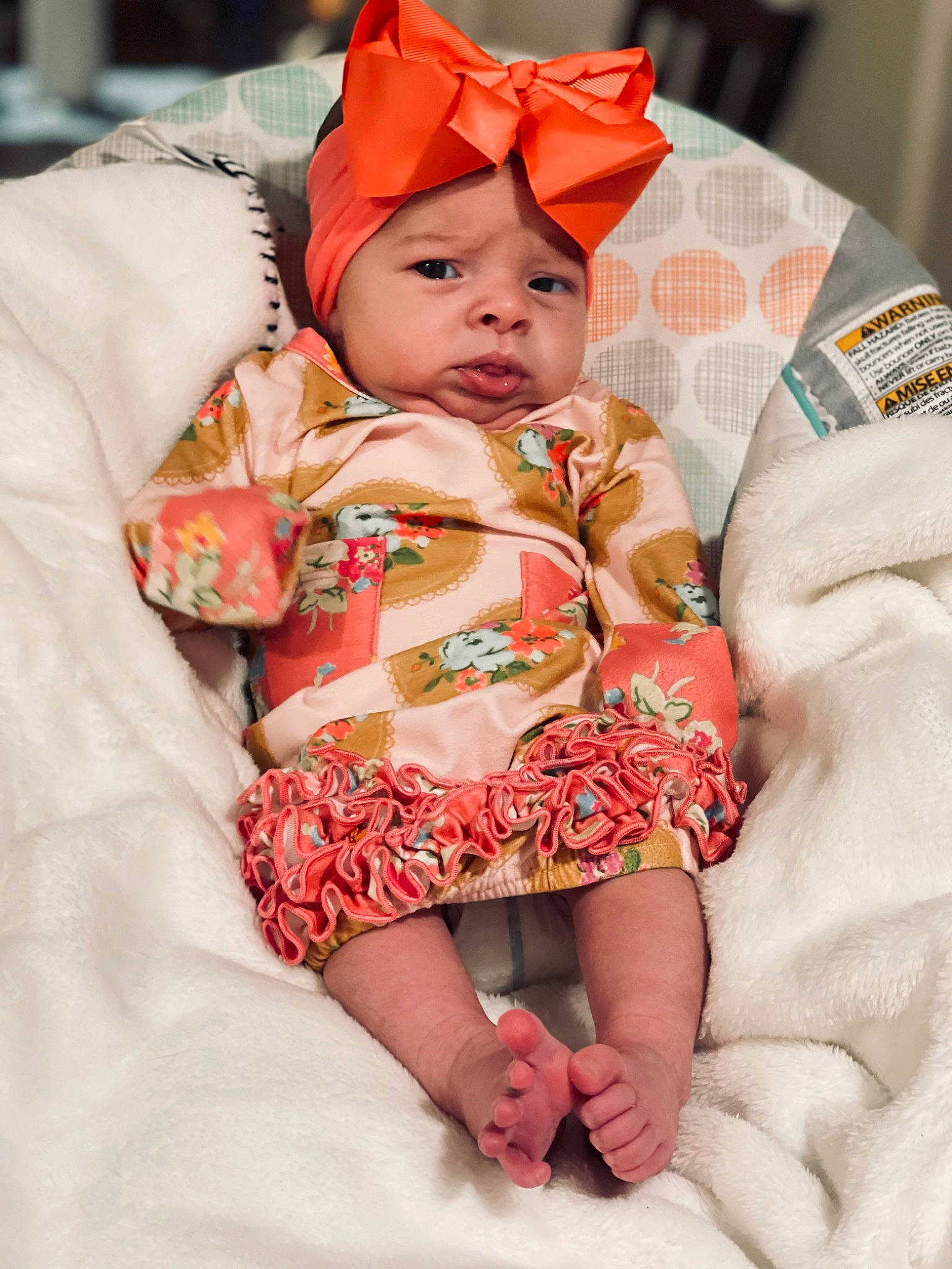 Legacy is registered to the contest to win money with this photo: baby, baby_toddler_clothing, cap, cheek, comfort, dress, eye, face, finger, happy, head, headwear, iris, lip, orange, outerwear, person, pink, skin, sleeve