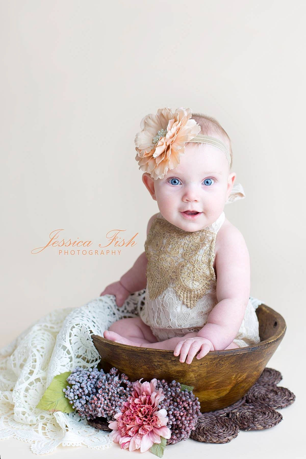 Azlyn is registered to the contest to win money with this photo: baby, cake, child, costume, fashion_accessory, figurine, hair_accessory, headgear, headpiece, person, pink, sitting, toddler