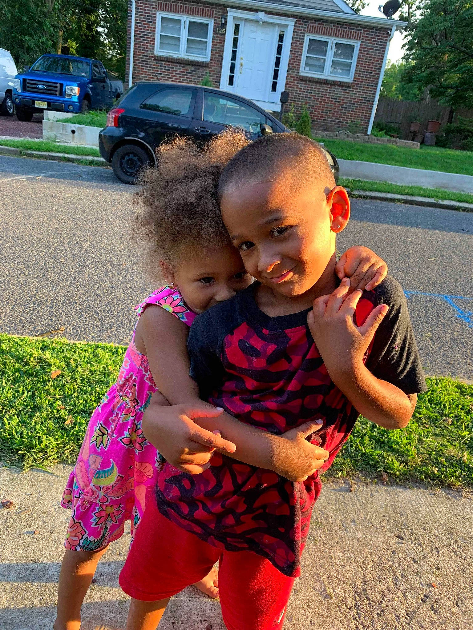 Jeremiah is registered to the contest to win money with this photo: child, daughter, face, facial_expression, fun, gesture, happy, head, interaction, joy, leaf, people, person, pink, play, skin, smile, summer, toddler, vacation