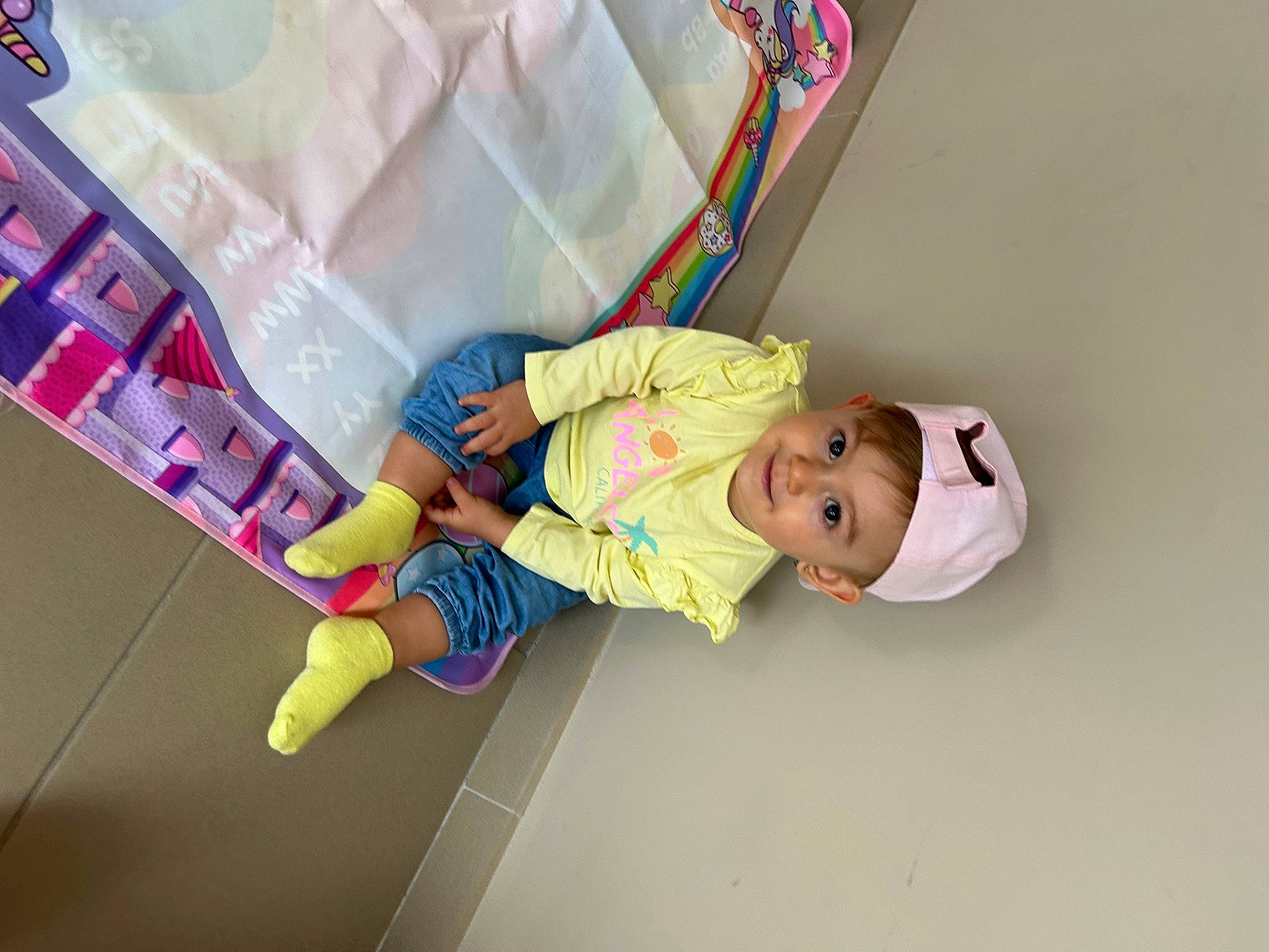 Jùllia a rejoint le concours — aidez-le/la à gagner de superbes lots ! baby, baby_products, baby_safety, baby_toddler_clothing, baby_toys, child, headwear, joy, linens, magenta, paper_product, pattern, person, pink, room, sleeve, smile, sock, toddler, wood