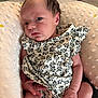 Savannah joined the competition — help win amazing prizes! newborn, baby, infant, child, floral_outfit, pillow, soft_texture, cute, portrait, indoors, skin, hand, foot, clothing, person, young, resting, comfort, curious, expression