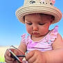 baby, child, hat, straw_hat, sunglasses, pink_clothing, outdoor, blue_sky, cute, summer, sunny, portrait, infant, face, looking_down, hands, closeup, person, childhood, nature