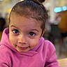 Aria Rose joined the competition — help win amazing prizes! child, toddler, face, portrait, pink_hoodie, smile, hair_bun, large_eyes, indoor, person, cute, young_child, casual_clothing, expression, looking_up, close_up, human, happy, girl, warm_lighting