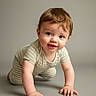 Winston joined the competition — help win amazing prizes! baby, crawling, child, infant, smiling, onesie, striped_clothing, curious, cute, portrait, indoor, soft_lighting, young_child, hands, face, happy, person, studio, neutral_background, small_fingers