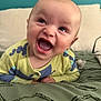 baby, child, smiling, happy, face, eyes, mouth, clothing, blanket, bed, pillow, indoor, infant, cute, expression, skin, head, person, lying, blue_wall