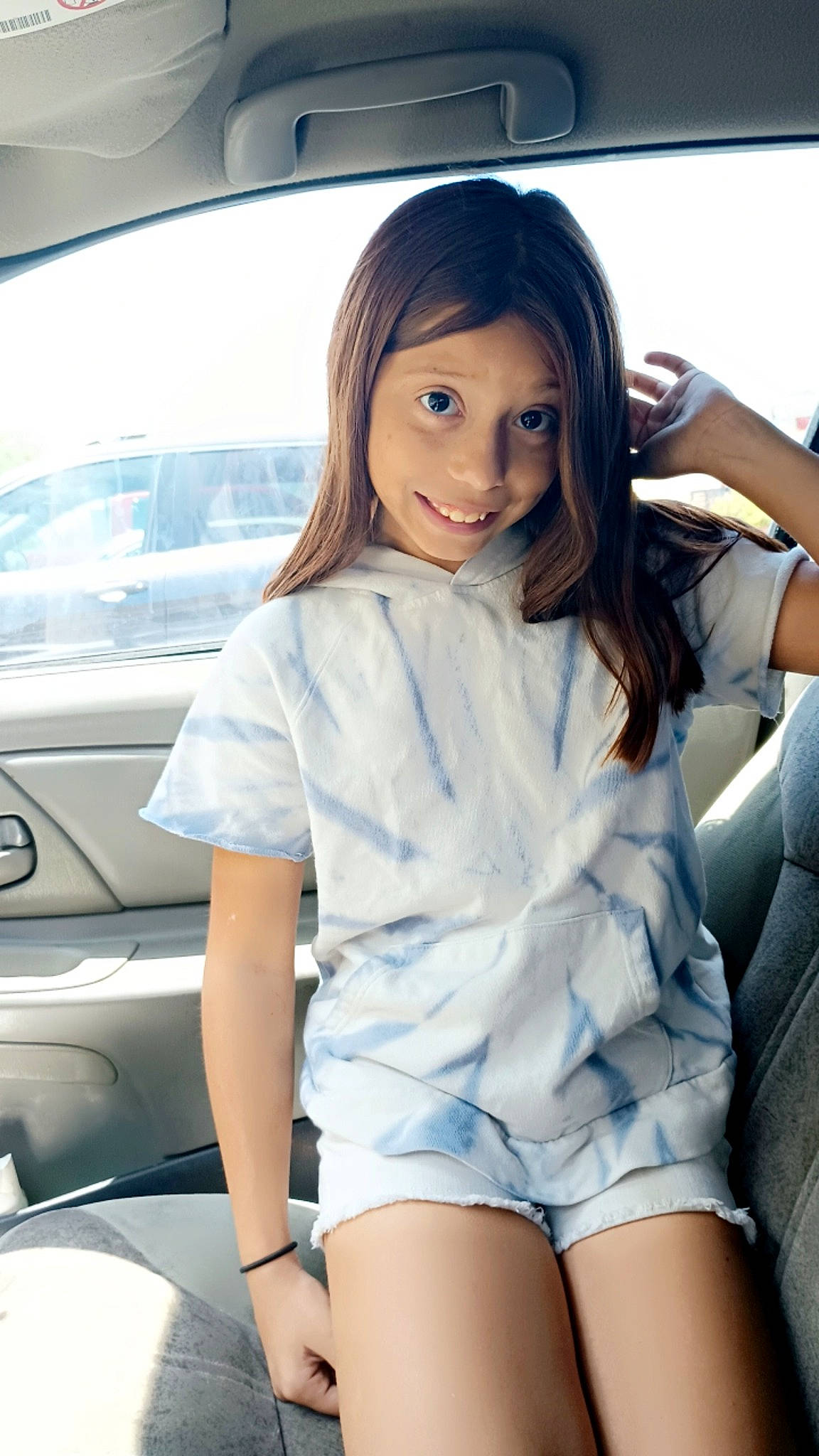 Tina is registered to the contest to win money with this photo: automotive_design, automotive_exterior, automotive_lighting, black_hair, cool, facial_expression, flash_photography, hair, hood, human_body, joy, long_hair, motor_vehicle, neck, person, personal_luxury_car, shorts, skin, sleeve, thigh