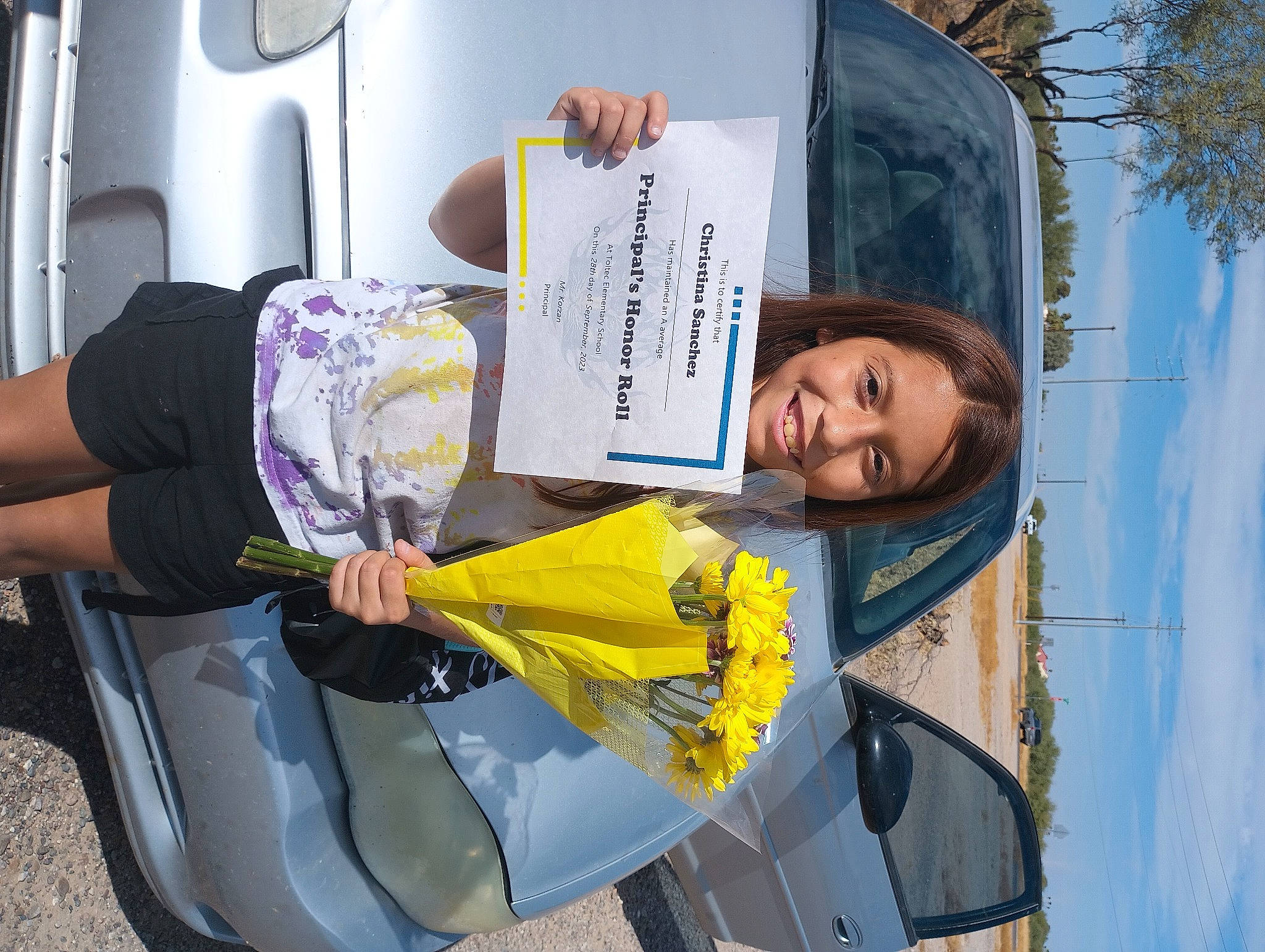 Tina is registered to the contest to win money with this photo: automotive_design, automotive_exterior, automotive_lighting, automotive_tire, beauty, bumper, car, dress, family_car, fashion, fun, human_leg, joy, motor_vehicle, person, plant, smile, tire, travel, vehicle