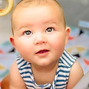 Beckett joined the competition — help win amazing prizes! baby, child, face, eyes, curious, innocence, striped_clothing, sleeveless, closeup, portrait, soft_lighting, indoor, cute, infant, skin, head, expression, young, person, background