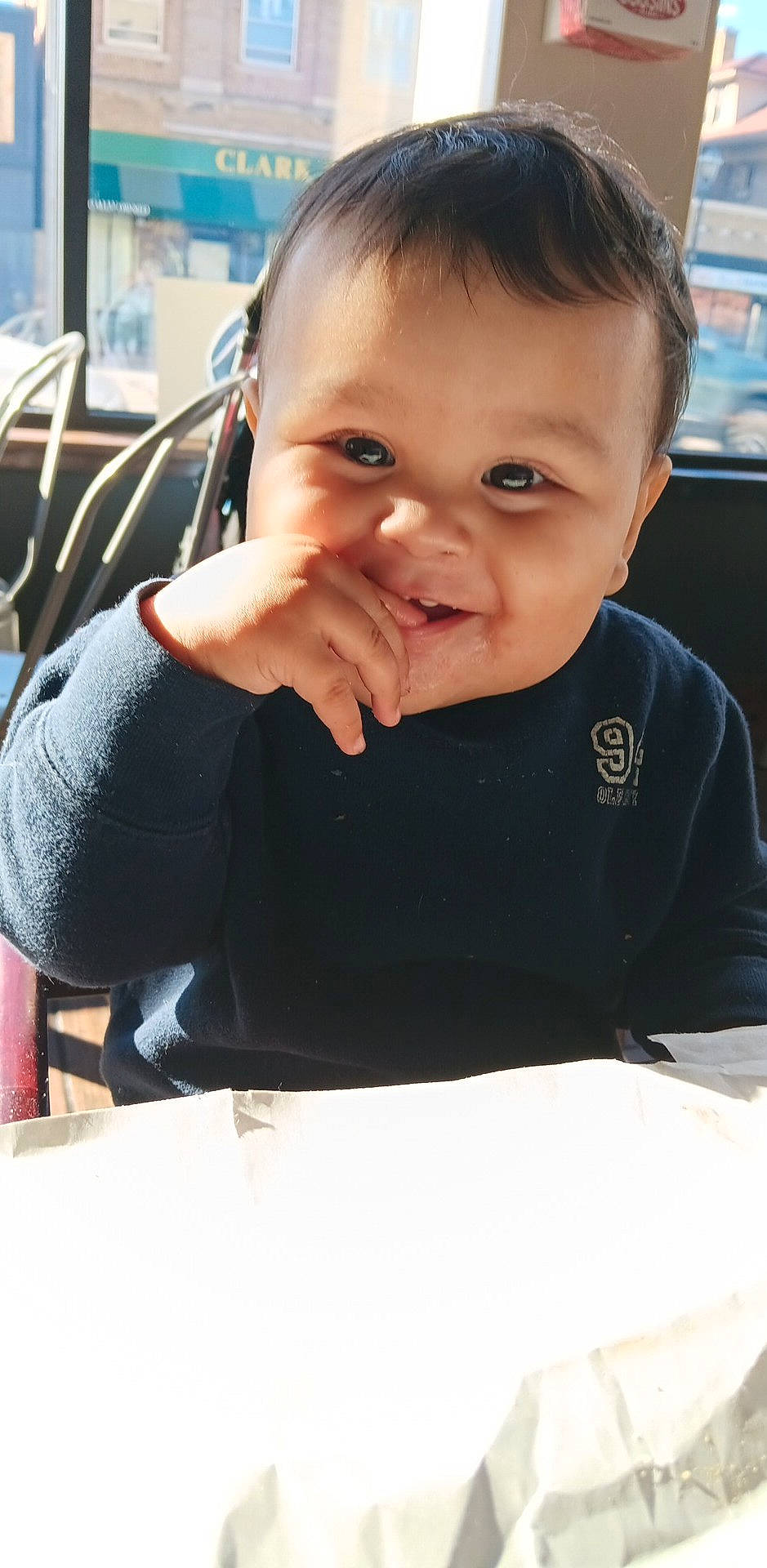 Xzavier joined the competition — help win amazing prizes! baby, baby_toddler_clothing, cheek, child, chin, eye, eyebrow, fun, gesture, happy, head, human_body, person, sitting, sleeve, smile, t_shirt, thumb, toddler, vacation