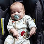 baby, pacifier, car_seat, onesie, infant, sleepy, child, cute, face, clothing, seat, indoor, person, young_child, baby_girl, baby_boy, comfort, adorable, child_care, resting