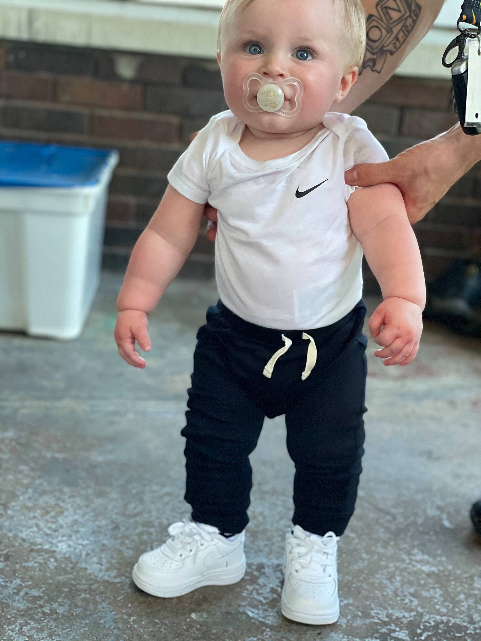 Javon is registered to the contest to win money with this photo: baby, baby_toddler_clothing, cheek, child, cool, electric_blue, flash_photography, flooring, fun, gesture, happy, head, knee, person, sleeve, standing, t_shirt, thumb, toddler, waste_containment