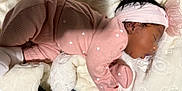 Amorah joined the competition — help win amazing prizes! newborn, baby, sleeping, pink_outfit, headband, bow, blanket, soft_texture, cozy, infant, cute, resting, child, warm, indoors, portrait, peaceful, tiny_hearts, socks, closeup