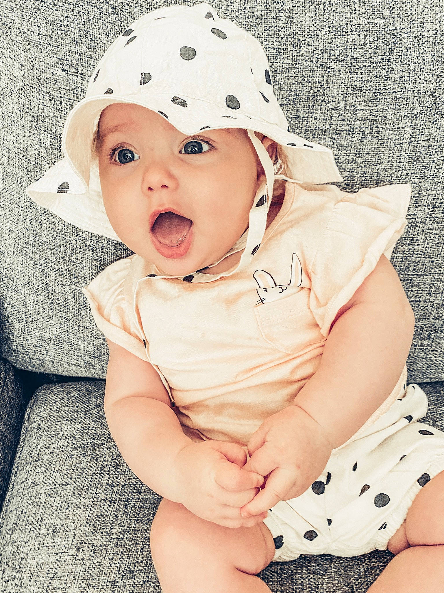 Phoebe joined the competition — help win amazing prizes! baby, baby_products, baby_toddler_clothing, beanie, cap, child, child_model, costume_accessory, design, fashion_accessory, hat, headgear, headwear, pattern, person, polka_dot, product, skin, sleeve, sun_hat