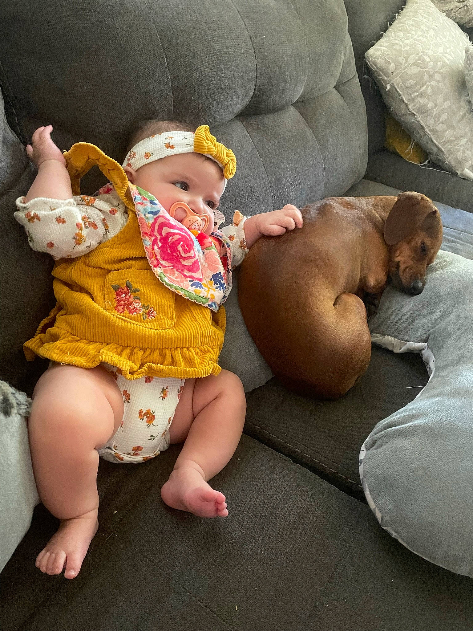 Adaline is registered to the contest to win money with this photo: abdomen, baby, baby_toddler_clothing, barefoot, comfort, eye, fawn, foot, head, headgear, headwear, human_body, human_leg, lap, leg, person, skin, stuffed_toy, thigh, toddler