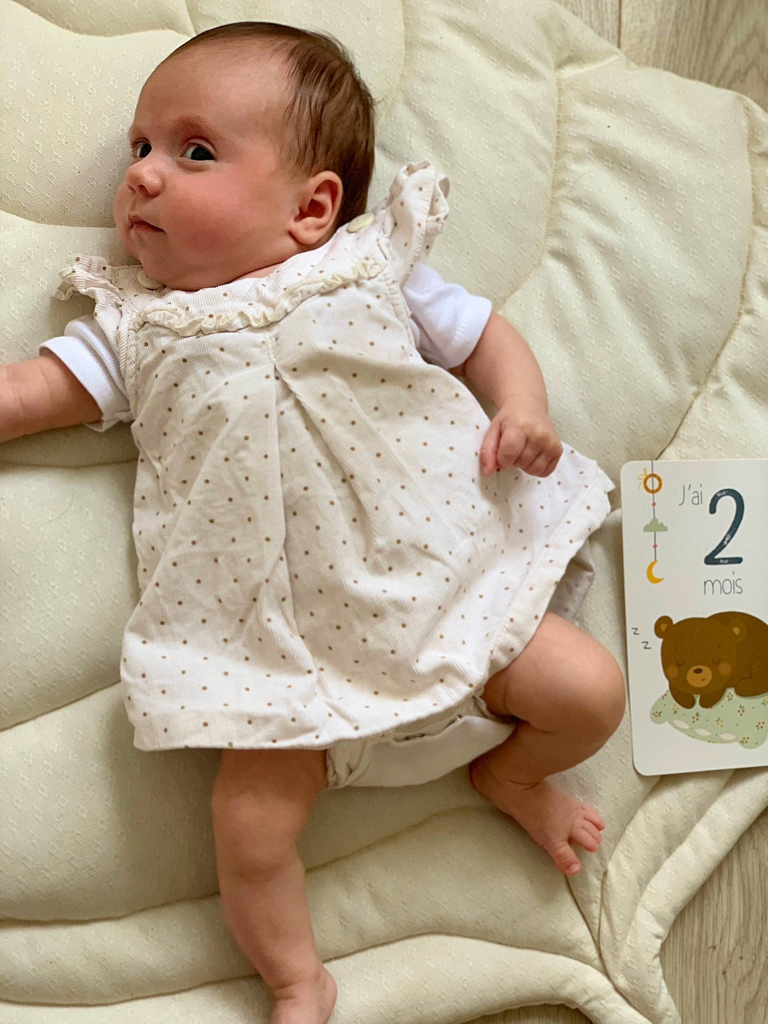 Victoire participe au concours pour gagner de l'argent avec cette photo : baby, baby_sleeping, baby_toddler_clothing, cheek, child, collar, comfort, face, head, linens, neck, outerwear, pattern, person, sitting, skin, sleeve, textile, thigh, toddler
