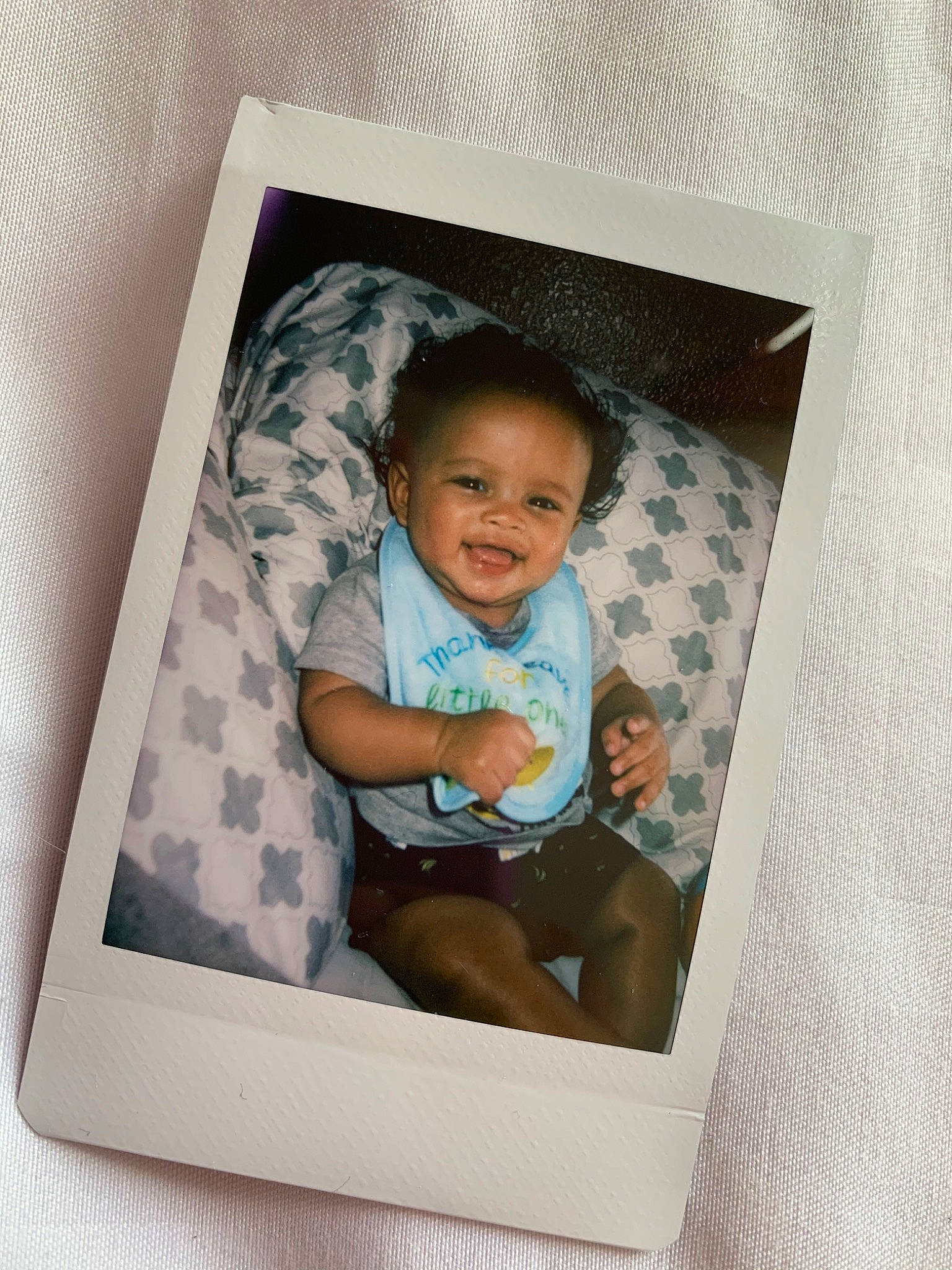 Kaeden is registered to the contest to win money with this photo: baby, child, person, picture_frame, room, toddler