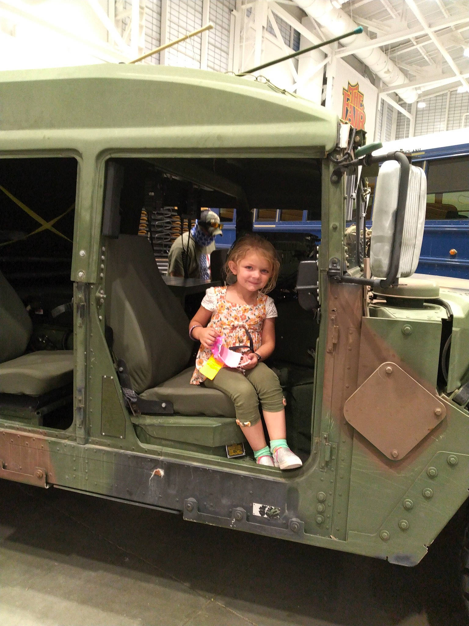 Alivia-may is registered to the contest to win money with this photo: auto_part, automotive_design, automotive_exterior, automotive_wheel_system, bumper, car, commercial_vehicle, gas, joy, machine, mode_of_transport, motor_vehicle, person, public_transport, shorts, t_shirt, tire, toddler, truck, vehicle