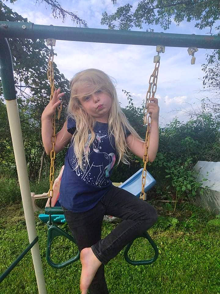 Autumn is registered to the contest to win money with this photo: city, cloud, electric_blue, fun, grass, grass_family, hair, happy, human_leg, leisure, people_in_nature, person, plant, public_space, recreation, sky, summer, swing, t_shirt, thigh