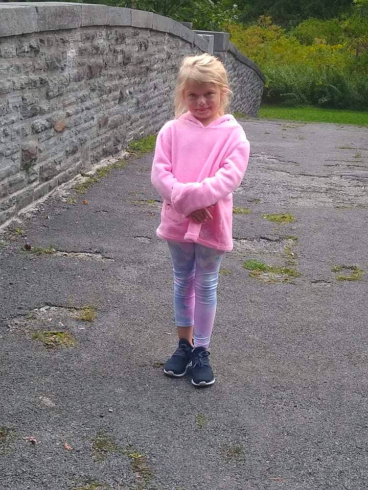 Autumn is registered to the contest to win money with this photo: asphalt, child, denim, grass, jacket, landscape, leisure, magenta, pattern, people_in_nature, person, plant, recreation, road, road_surface, sidewalk, sleeve, soil, toddler, tree