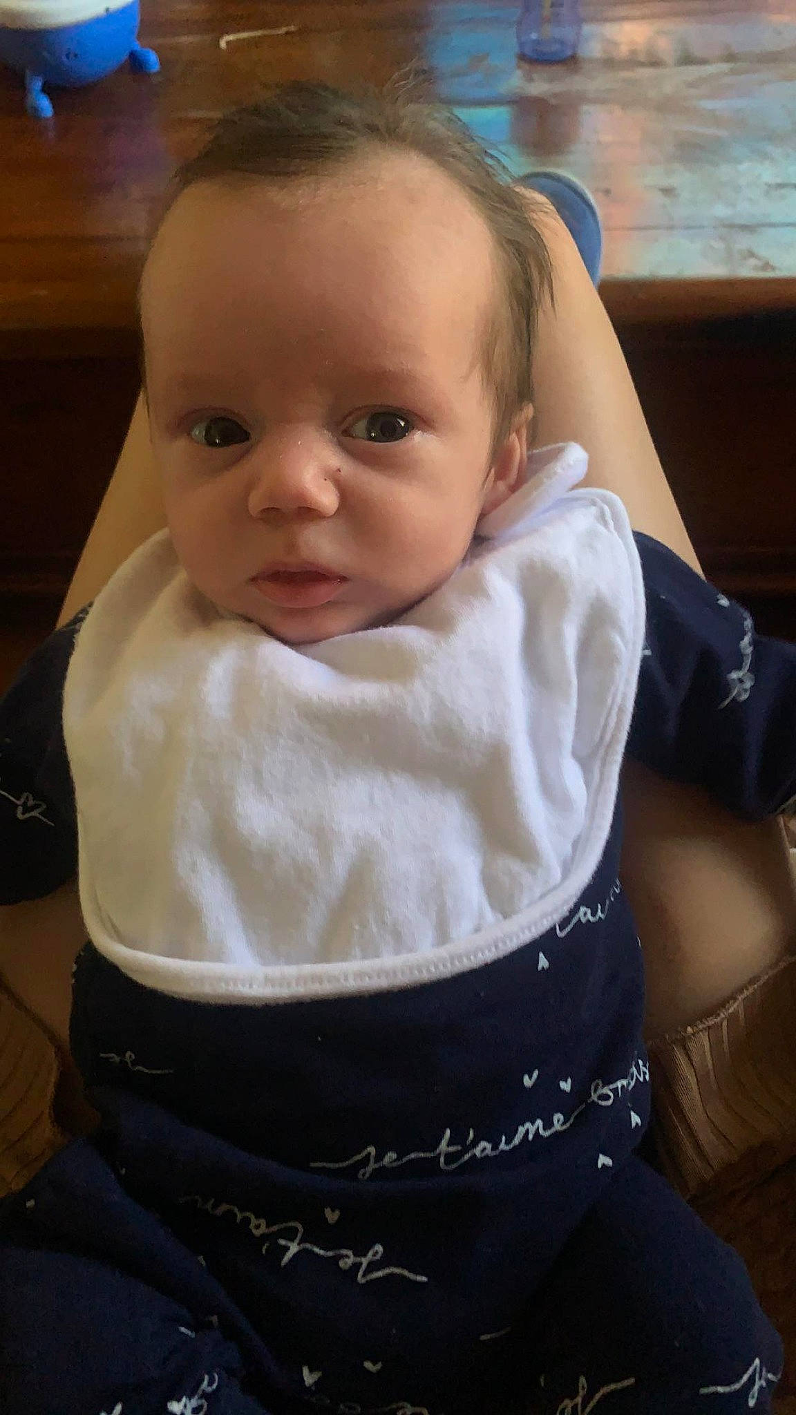 Callum is registered to the contest to win money with this photo: abdomen, baby, baby_products, baby_toddler_clothing, cheek, chest, child, comfort, elbow, eyelash, hair, head, iris, lip, neck, person, sitting, sleeve, t_shirt, toddler
