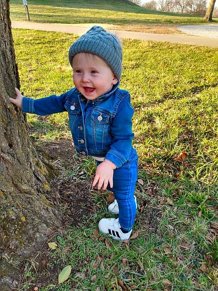 Avalynn is registered to the contest to win money with this photo: baby_toddler_clothing, cap, child, electric_blue, face, fun, grass, grass_family, grassland, happy, headwear, landscape, nature, outerwear, people_in_nature, person, plant, smile, soil, toddler