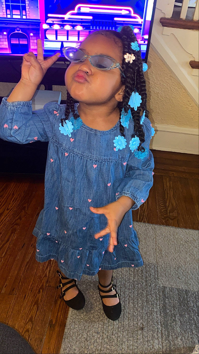 Camryn joined the competition — help win amazing prizes! arm, baby_toddler_clothing, black_hair, blue, cool, dress, eye, face, facial_expression, hair, head, headgear, neck, person, pink, purple, shoulder, skin, sleeve, t_shirt