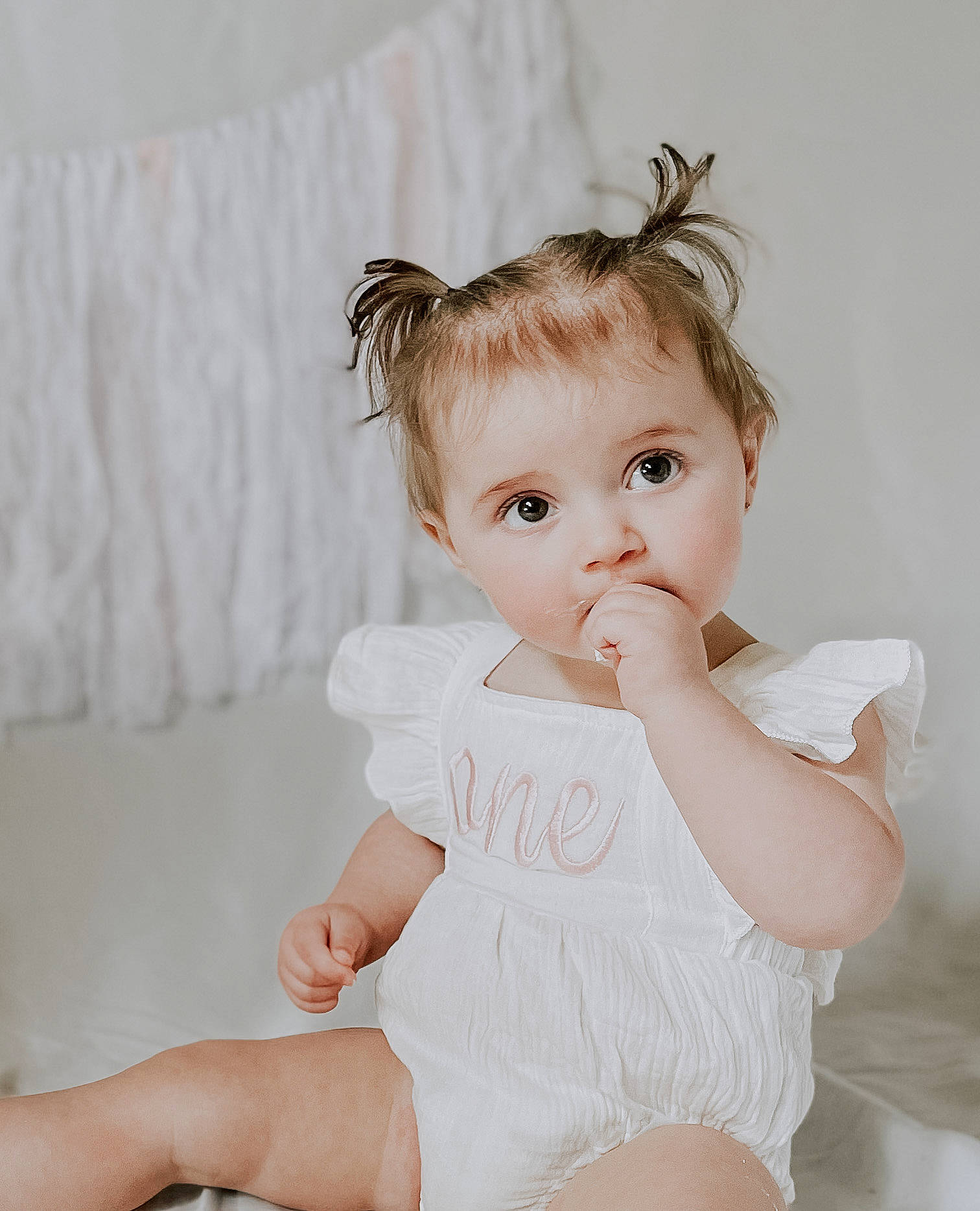 Addyson is registered to the contest to win money with this photo: arm, baby_toddler_clothing, blond, child, eyelash, fashion_accessory, flash_photography, happy, headpiece, human_leg, knee, neck, pattern, person, shoulder, skin, sleeve, thigh, toddler, white