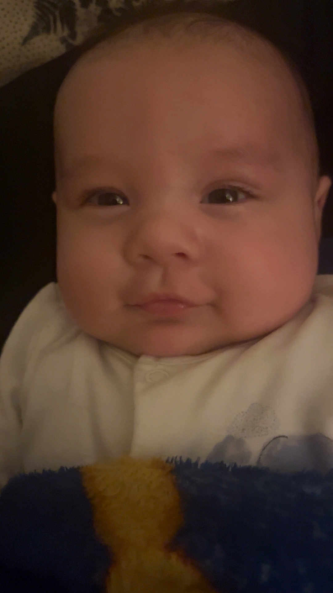 Tate joined the competition — help win amazing prizes! baby, face, infant, blanket, clothing, portrait, closeup, cute, child, smile, skin, head, eyes, cheeks, newborn, warm, soft, indoors, sleepwear, comfort