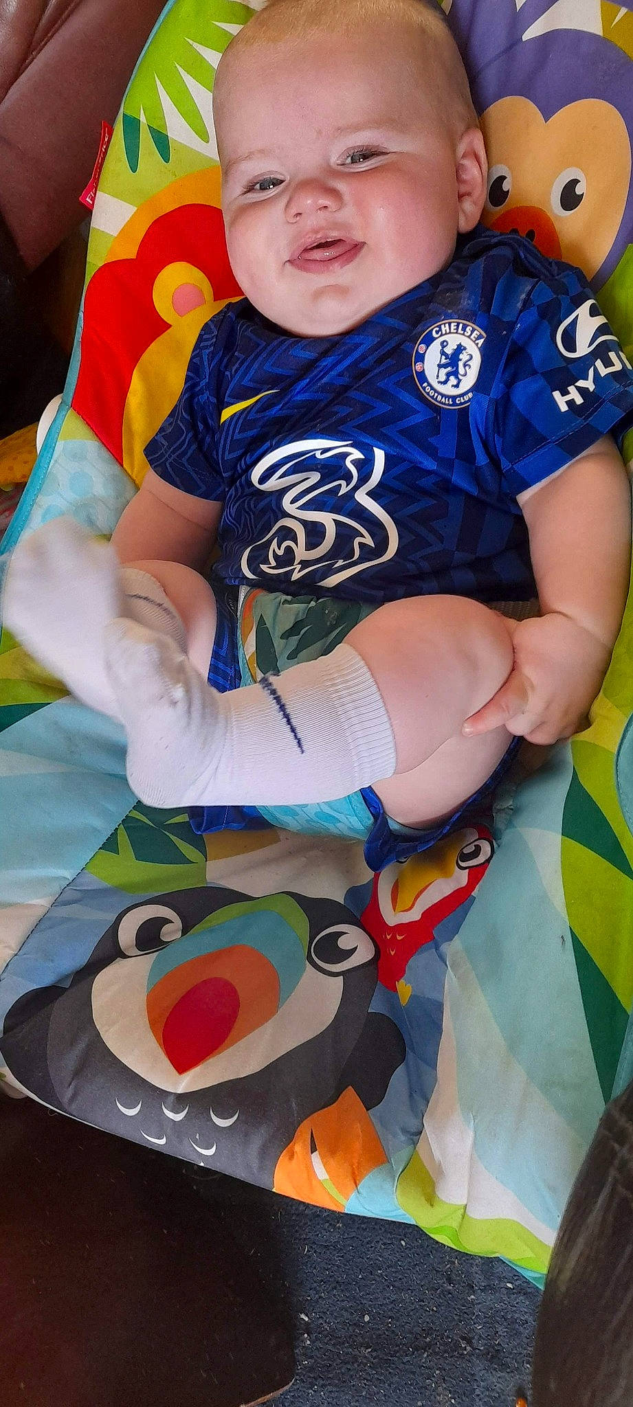 Grant is registered to the contest to win money with this photo: arm, baby, baby_toddler_clothing, blue, fun, hand, happy, leg, leisure, mouth, orange, person, recreation, shirt, shorts, sleeve, t_shirt, thigh, toddler, white