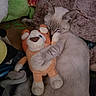 Pretty Boy is registered to the contest to win money with this photo: cat, stuffed_animal, plush_toy, sleeping, hugging, cozy, cute, soft, blanket, colorful, fur, indoor, resting, pet, toy, animal, close_up, comfort, nap, relaxation
