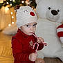 Lizyo participe au concours pour gagner de l'argent avec cette photo : toddler, child, hat, candy_cane, red_clothing, reindeer_hat, holiday, christmas, decorations, teddy_bear, floor, indoors, cute, festive, toy, background, lights, portrait, seasonal, sitting